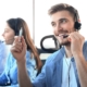 Image of a call center agent smiling on a phone call with a client.