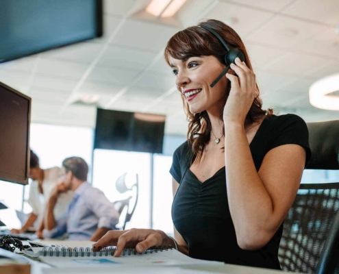 Woman working in call center smilling